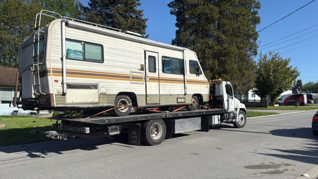 Same day car purchase in Vancouver - vintage motorhome loaded onto our flatbed for immediate pickup